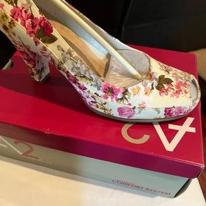 Floral peep toe heels.